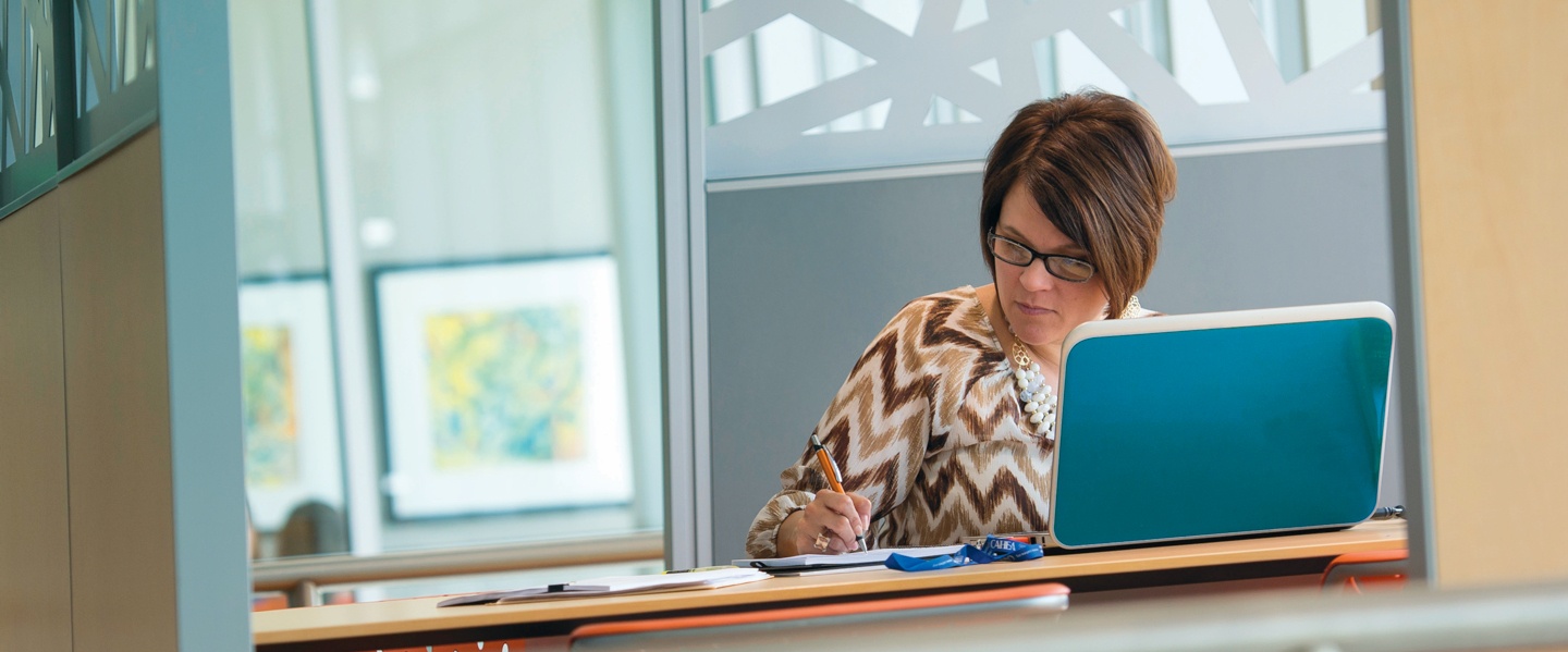 Adult student working on her assignments in the Snyder Academic Building