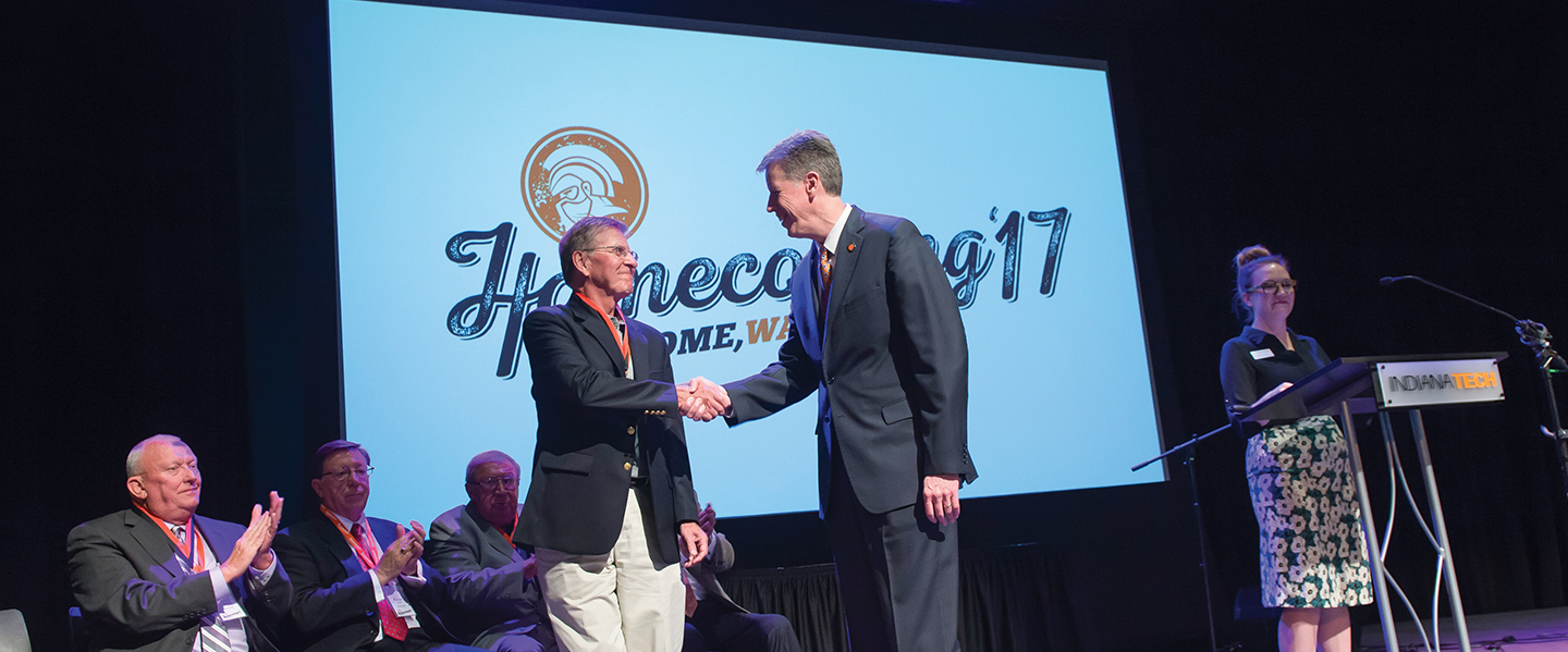 President Einolf shaking hands with alumni during Homecoming 2017